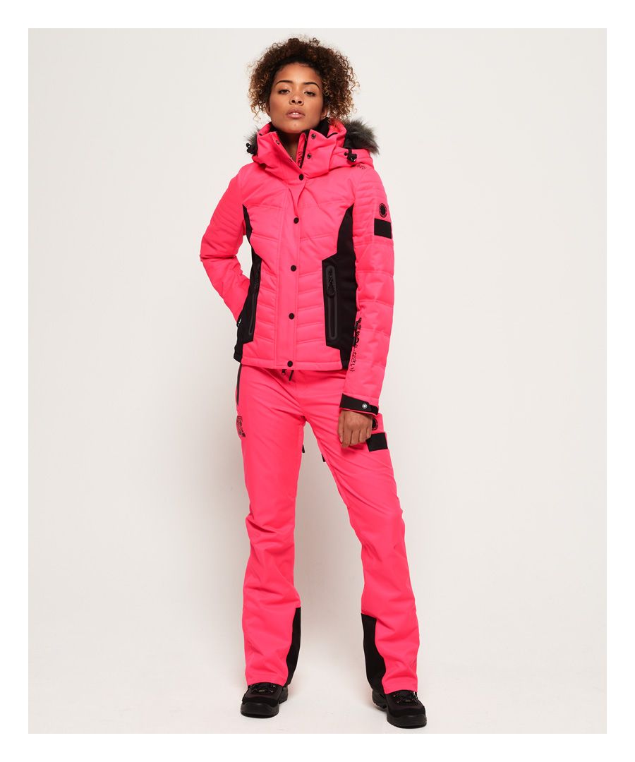 Superdry women’s Snow Pant. Designed for the slopes, these Snow pants feature a zip and popper fastening, waist adjuster straps and two front zip fastened pockets to keep your keys and phone safe. The Snow Pants also feature two back pockets with popper fastening, zip fastened thigh vents for breathability and zipped hems with hook and loop fastened boot gaiters. These snow pants are made with a water resistant fabric, as well as coated zips to ensure you stay as dry as possible on the slopes. The Snow Pants are completed with a Superdry logo on the right leg and two Superdry Snow badges on the left leg.Water resistance <10,000mmWind resistance <10,000g