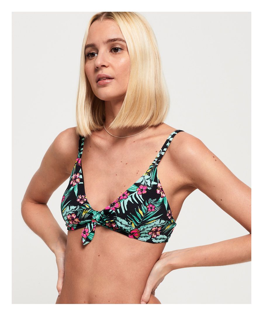 Superdry women's Felicity tie crop bikini top. Add a pop of print to your poolside style with this bikini top, featuring a classic triangle shape with soft padding and adjustable straps. Finished with a bow in the centre, Superdry metal logo badge and a back clasp fastening.Matching bottoms available.Please note due to hygiene reasons, we are unable to offer an exchange or refund on swimwear, unless they are sealed in their original packaging. This does not affect your statutory rights.