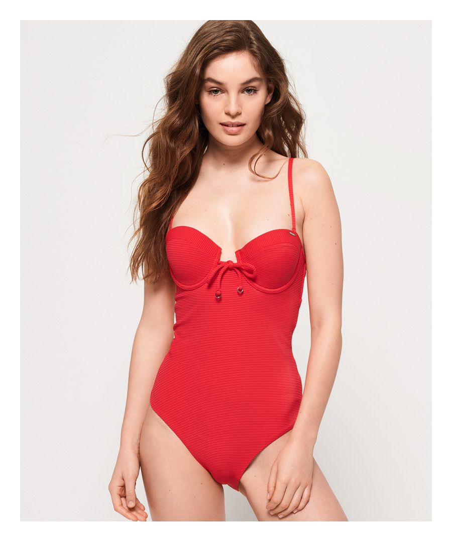 Superdry women's Alice textured cupped swimsuit. Make a splash in style this season with the Alice textured cupped swimsuit. This swimsuit features knot detailing at the front, adjustable, detachable shoulder straps and a rear clasp fastening. This swimsuit is completed with a logo badge on the cup.Please note due to hygiene reasons, we are unable to offer an exchange or refund on swimwear, unless they are sealed in their original packaging. This does not affect your statutory rights.