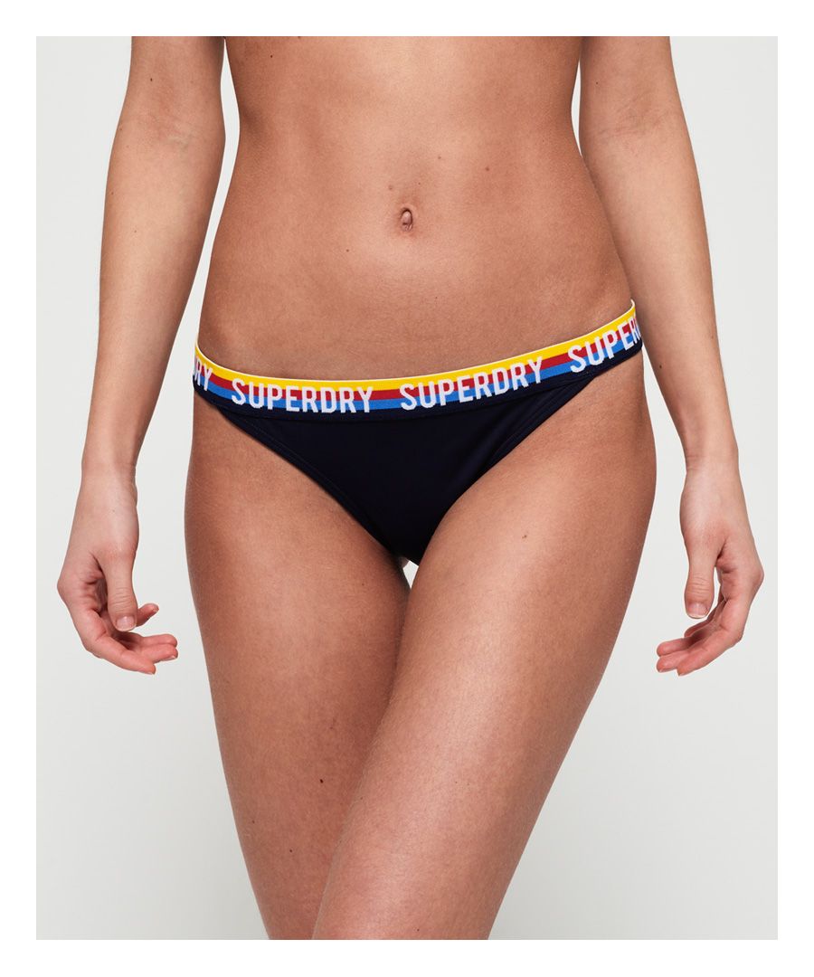Superdry women's Sydney bikini bottoms. A plain bikini bottom with an elasticated waist with stripe and Superdry logo detailing. Matching top available.Please note due to hygiene reasons, we are unable to offer an exchange or refund on underwear, unless they are sealed in their original packaging. This does not affect your statutory rights.