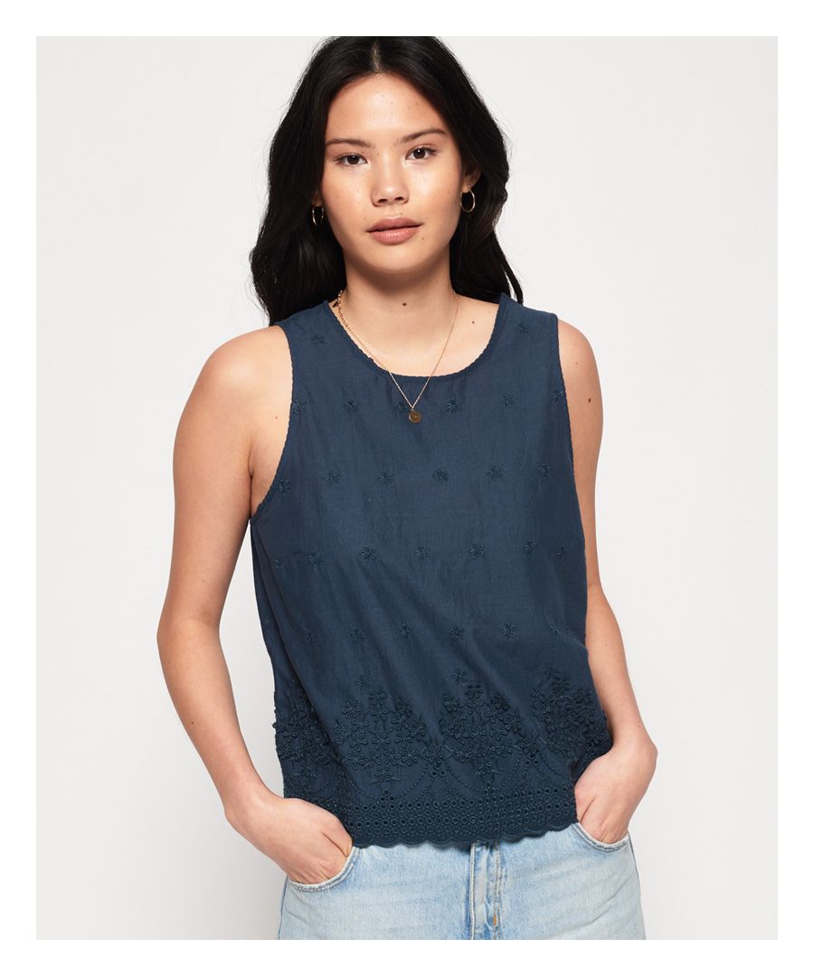 Superdry women’s Hanna shell top. This statement top is perfect for the summer featuring an all over embroidered pattern, and a scallop shaped hem. The Hanna shell top features a button fastened neckline, and finished with a Superdry logo badge on the hem.
