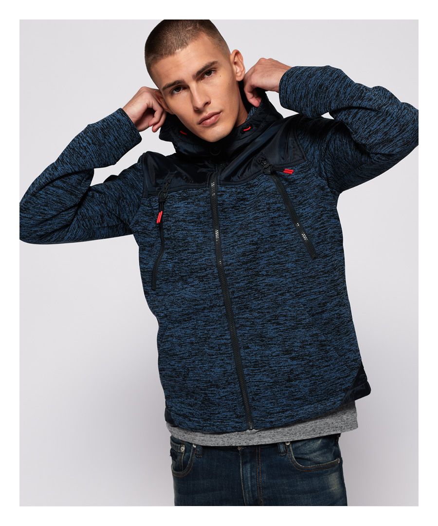 Superdry men’s Mountain zip hoodie. Inspired by Mountaineering gear, this hybrid zip hoodie features a bungee cord adjustable hood, four front pockets and a bungee cord adjustable hem. The Mountain zip hoodie also features a branded placket and an applique Superdry Mountain badge on the sleeve. The zip hoodie is finished with an embroidered Superdry logo on the shoulder.