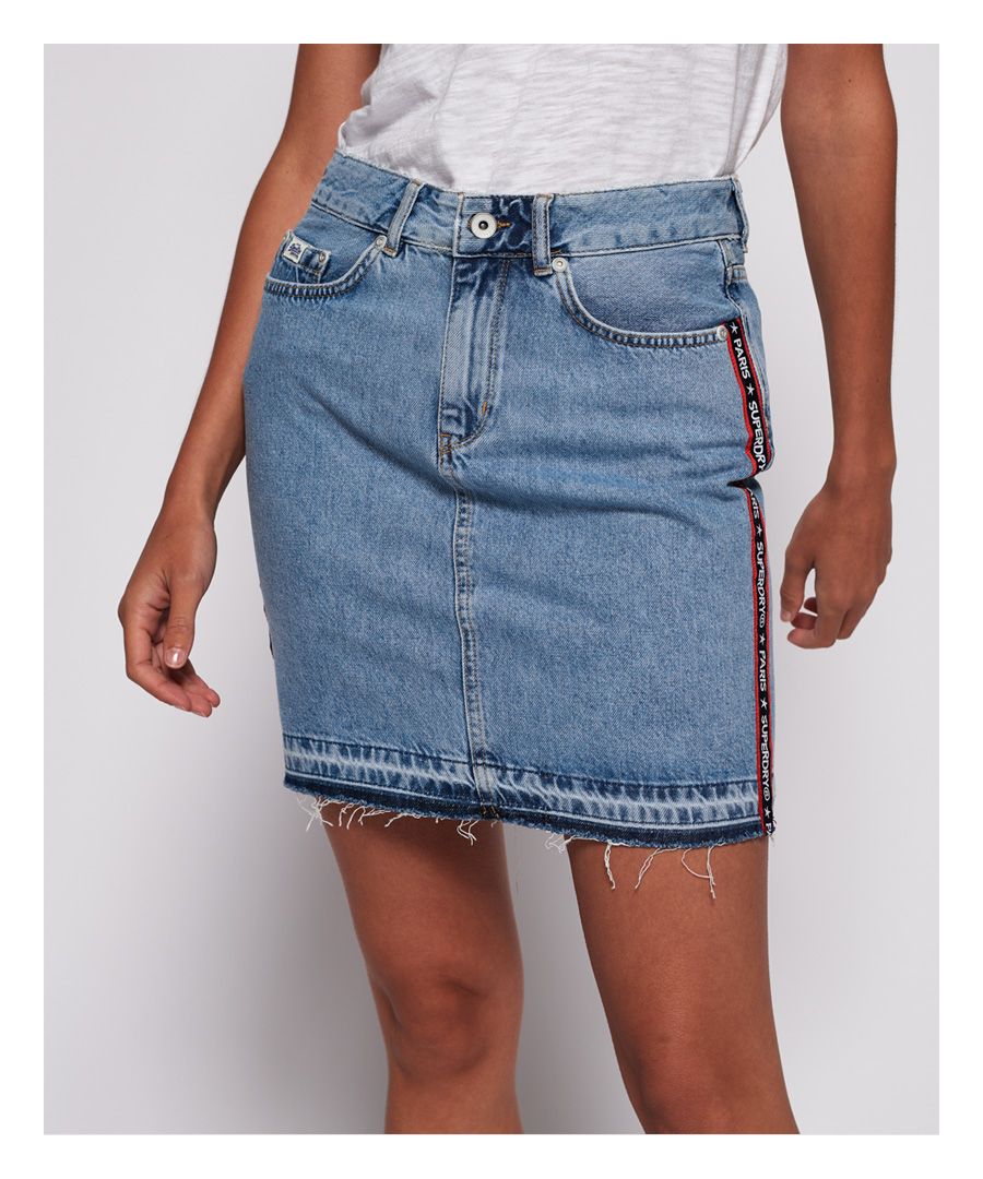 Superdry women’s denim mini skirt. This essential denim mini skirt features the classic five pocket design, a Vintage Superdry logo badge on the coin pocket and an embossed leather logo patch on the back waistline. This denim skirt is completed with a distressed hem.