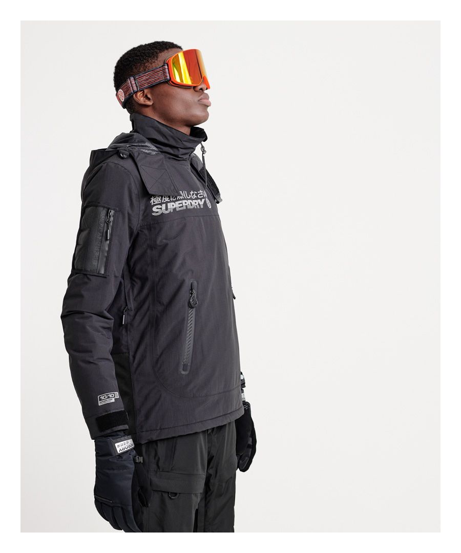 Superdry men's Snow rescue overhead jacket. This snow jacket features a half zip fastening, drawstring adjustable hood, a seam zip for comfortable sitting, zip fastened underarm ventilation, anti scuff material on the back, hook and loop collar fastening, and adjustable powder skirt. The jacket also benefits from a zip fastened pocket on the sleeve, large pouch pocket with zip fastenings, and a smaller inside pouch pocket with media outlet and a cloth to clean your goggles. The Rescue overhead jacket is finished with hook and loop adjustable cuffs, cuff linings with thumbholes, Superdry logos on the chest and back, and Superdry badges on one sleeve.Water resistance <10,000mmBreathability <10,000g