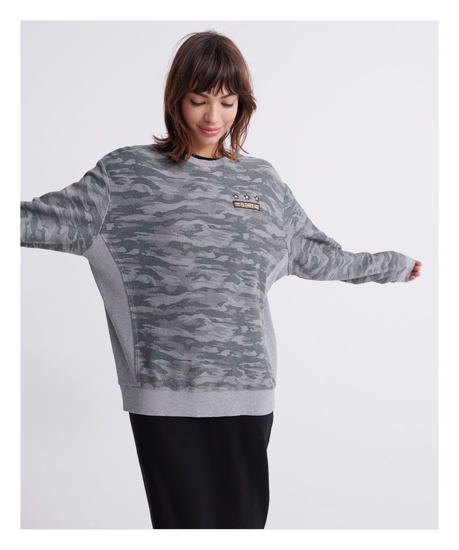 Superdry women's Dry Camo patch crew sweatshirt. Dress up your everyday wear this season. This sweatshirt features a crew neck design with ribbed cuffs and hem. Finished with a Superdry badge on the chest, this can be paired with jeans and boots for a stylish contemporary look.