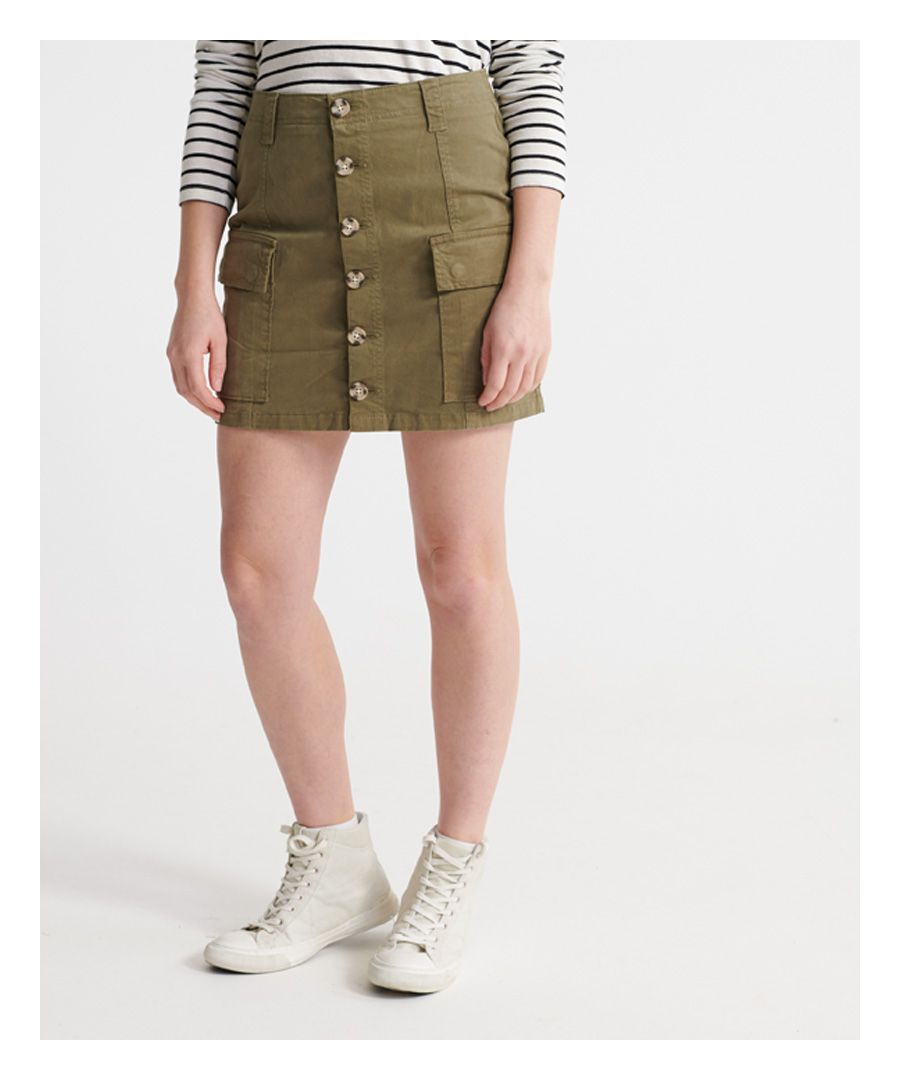 Superdry women's Alchemy cargo mini skirt. This cargo skirt features a button up fastening, two front pockets with popper fastening, belt loops and two back pockets.