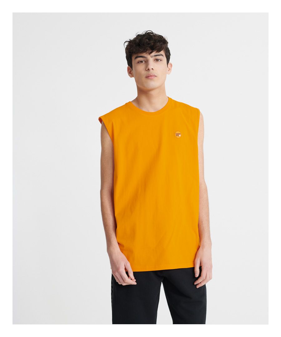 Superdry men's Collective oversized vest top. Update your vest collection for those warmer days with this vest featuring a ribbed crew neck, trim armholes, a Superdry logo badge on the chest and Superdry logo tab on one side seam.Made with Organic Cotton - Made using cotton grown using organic farming methods which minimise water usage and eliminate pesticides, maximising soil health and farmer livelihoods.