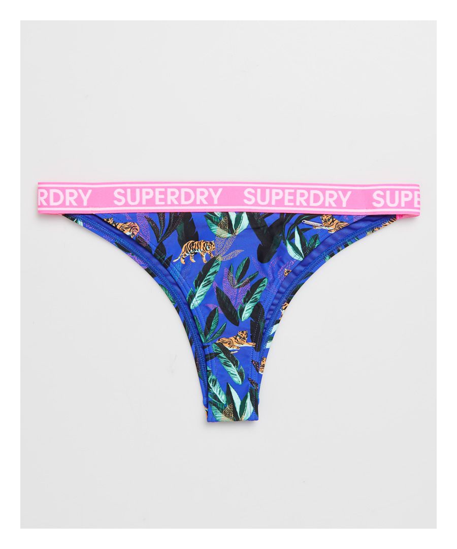 Superdry women's Jungle bikini briefs. These bikini briefs feature an all over print, Superdry logo elasticated waistband and is complete with a metal Superdry logo on the waistband.Please note due to hygiene reasons, we are unable to offer an exchange or refund on swimwear, unless they are sealed in their original packaging. This does not affect your statutory rights.
