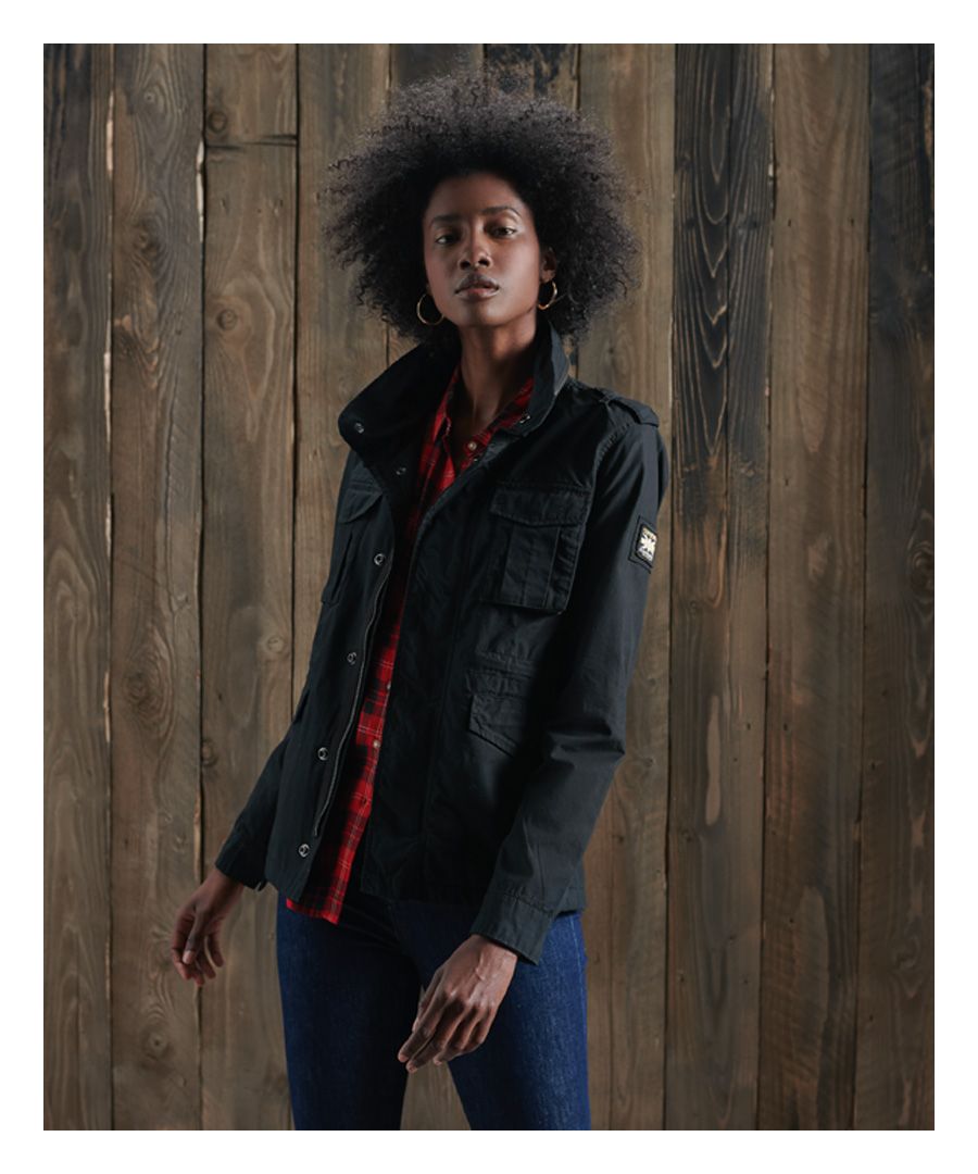 Superdry women's Ripstop Rookie jacket. This military inspired jacket features a main zip and popper fastening, a drawstring waist, four popper fastened pockets and two pouch pockets. This jacket also features popper fastened cuffs, zip detailing on the collar and shoulder epaulettes. Finished with a Superdry logo badge on one sleeve.