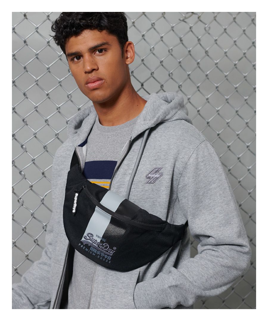 Keep your essentials close this season with the Vintage Logo bumbag, keeping your comfort in mind with a padded back.Main zipped compartmentInside zipped compartmentPadded mesh backAdjustable waist strap with buckle fasteningH: 18.5cm x W: 41cm x D: 8.5cm