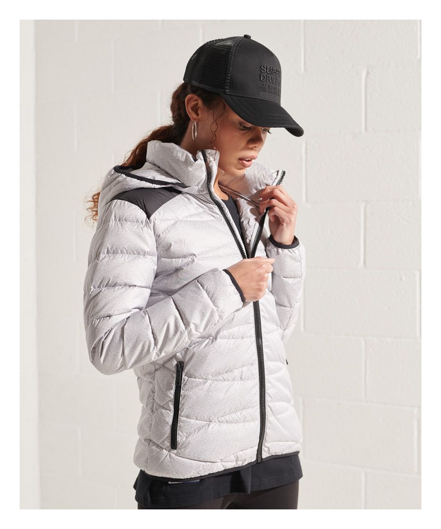 Superdry women's Radar down jacket. Get warm in style with this down puffer jacket featuring a hood with elasticated hood, elasticated hem, a zip fastening, two pockets and elasticated cuffs. Finished with a Superdry badge on one sleeve, this puffer jacket made with a 90/10 premium dock down filling could be your next favourite coat.Superdry is certified by the Responsible Down Standard to confirm that our down filled products are sourced to ensure animal welfare.