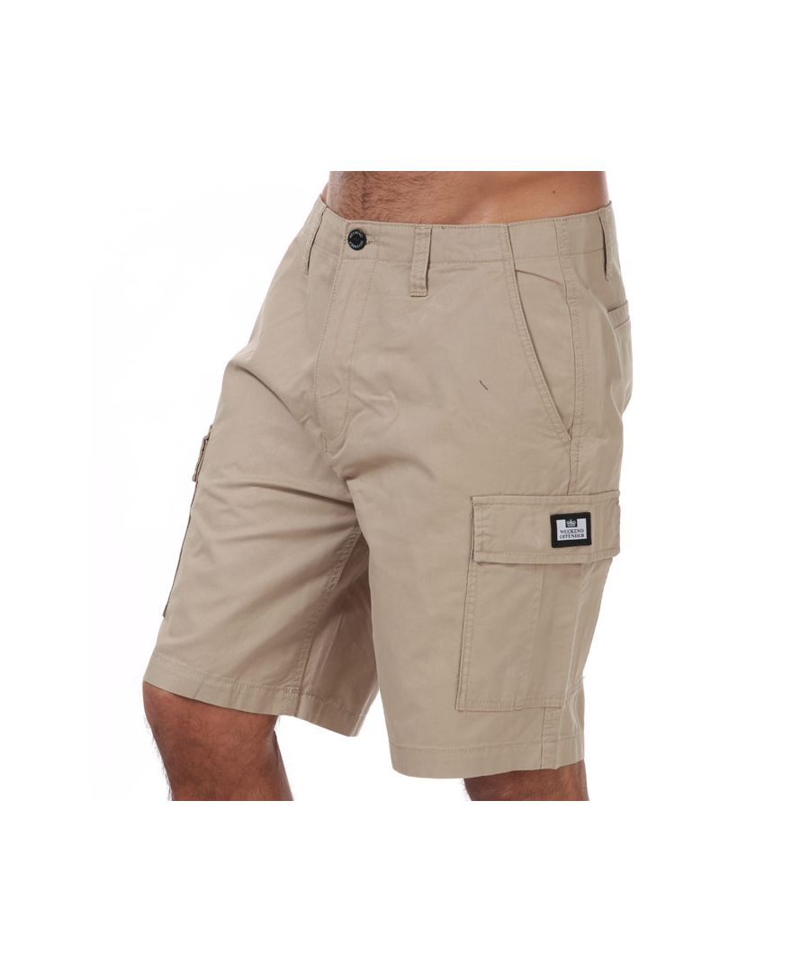 Mens Weekend Offender High Desert Cargo Short in stone.- Zip fly.- Slip pockets to sides and reverse.- Button pockets to front.- Weekend Offender Printed Logo to side pocket.- Belt loops to waist.- Tonal stitching.- Main material: 100% Cotton. Machine washable. - Ref: WOSST501